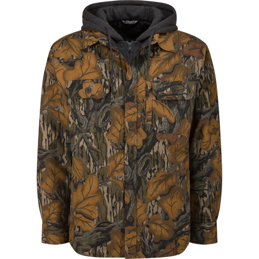 The Campfire Flannel Hoodie featuring a Mossy Oak Fall Foliage autumn leaf and wood grain camouflage pattern, with a grey hooded insert and front chest pockets.