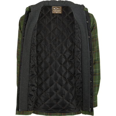 A person wearing the Drake Campfire Flannel Hoodie, a green and black plaid jacket with quilted insulation and an adjustable hood.