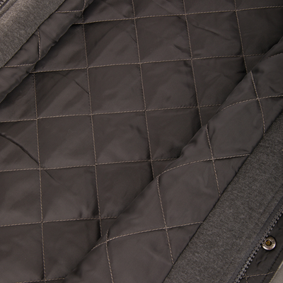 Close-up of the dark grey quilted lining inside a Campfire Flannel Hoodie.