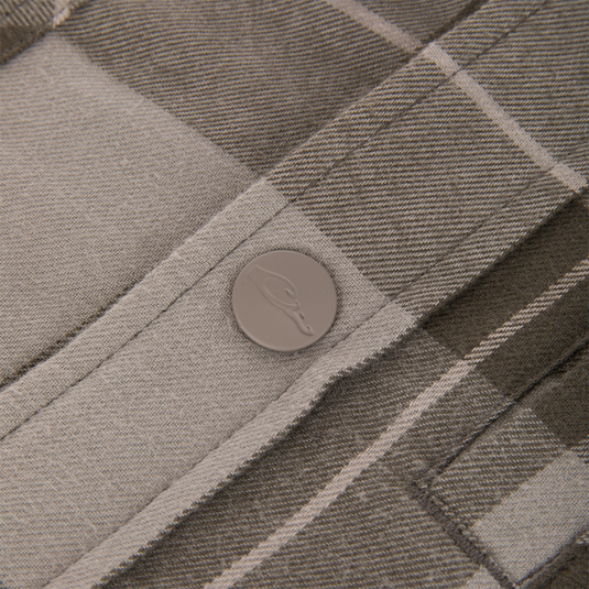 Close-up of a gray plaid Campfire Flannel Hoodie featuring a matte gray button embossed with a duck silhouette.