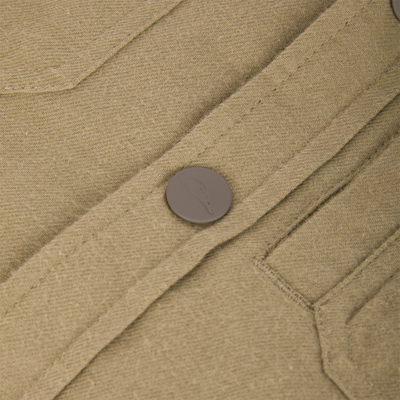 Close-up of The Youth Campfire Flannel Hoodie's buttoned pocket detail, showcasing its durable construction and textured outer fabric, ideal for outdoor adventures.
