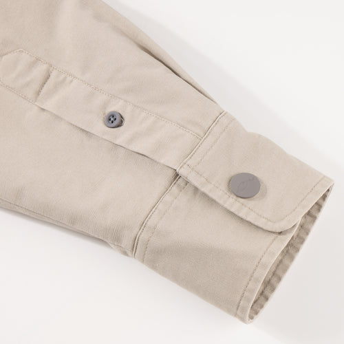 Close-up of the Campfire Canvas Shirt Jac Hoodie, highlighting buttoned cuff and placket, showcasing durable craftsmanship ideal for outdoor comfort and style.