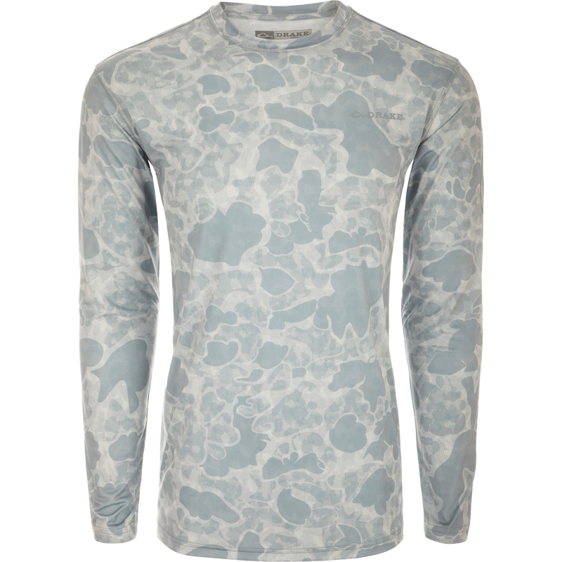 A lightweight Performance Crew shirt with a camouflage pattern, built-in cooling, UPF 50 sun protection, moisture-wicking, and quick-drying features. Perfect for outdoor activities.