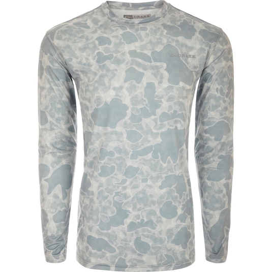 A lightweight Performance Crew shirt with a camouflage pattern, built-in cooling, UPF 50 sun protection, moisture-wicking, and quick-drying features. Perfect for outdoor activities.