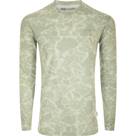 A high-performance crew shirt with a camouflage pattern. Built-In Cooling, UPF 50, Moisture Wicking, Breathable Stretch, and Quick Drying. Perfect for outdoor activities.