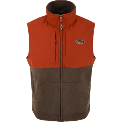 Eqwader Vest close-up, highlighting mid-layer insulation, waterproof shoulders, and breathable fleece lower torso, featuring chest pockets for secure storage.