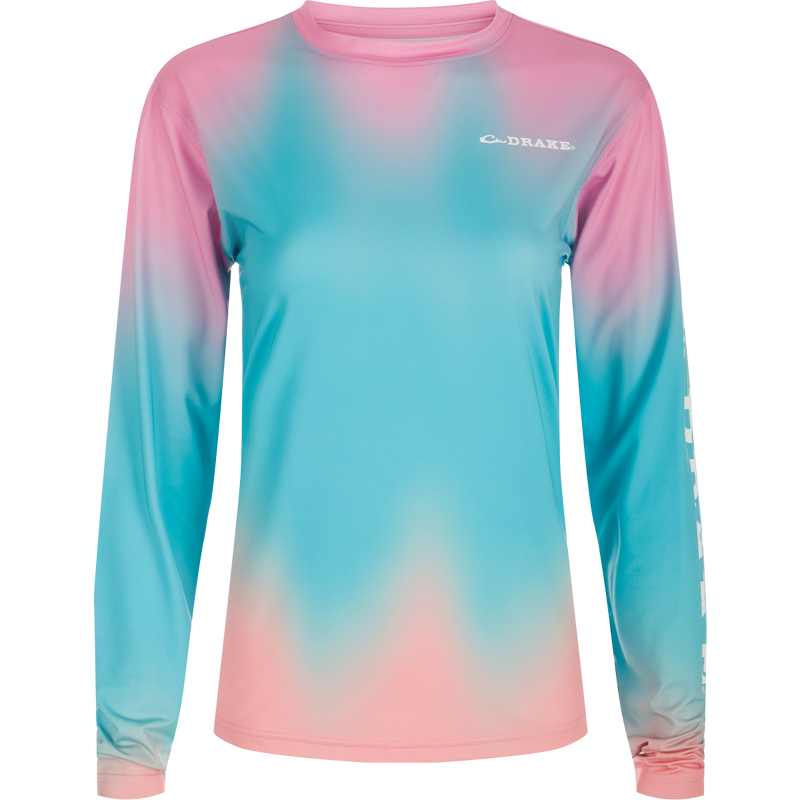 Women's Performance Crew Print L/S: A lightweight, moisture-wicking shirt with UPF 50 sun protection. Features built-in cooling and quick-drying fabric for active wear. Ideal for water activities and outdoor adventures.