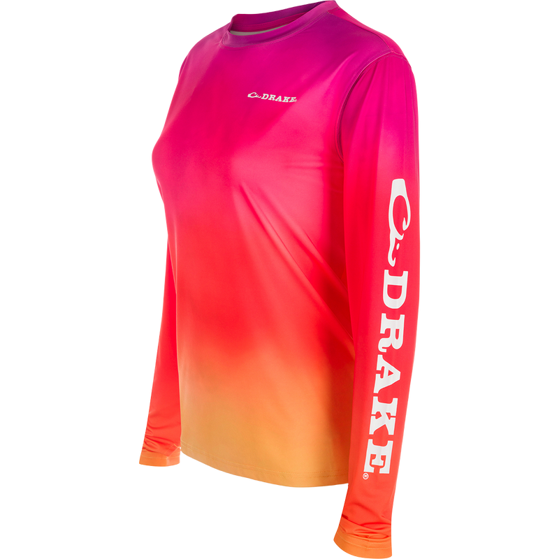 Women's Performance Crew Print L/S: A lightweight, moisture-wicking shirt with UPF 50 sun protection. Features built-in cooling and quick-drying fabric for ultimate comfort. Perfect for outdoor activities.