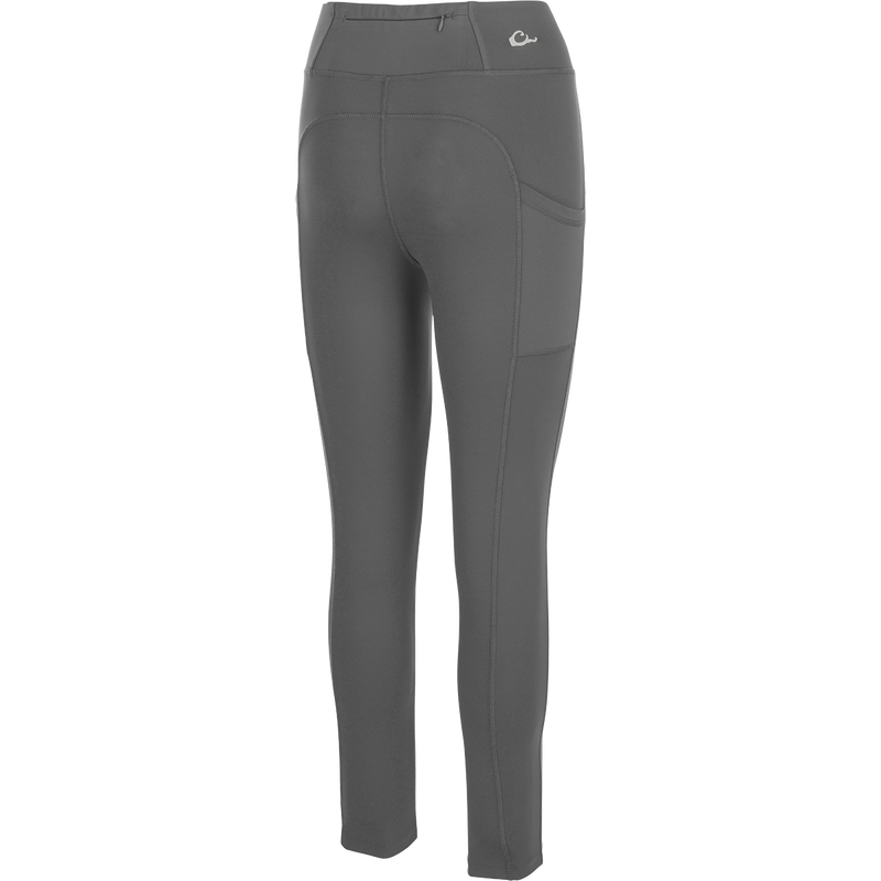 Women's Commando Solid Legging, a versatile high-performance legging with 4-way stretch fabric. Features include a 4-inch waistband, back zippered pocket, and angled side seam pockets. Quick drying and moisture-wicking for your next adventure.