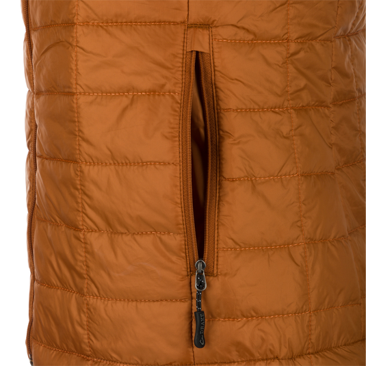 Women's Synthetic Down Pac-Vest: Close-up of a tan jacket with zipper and side pockets. Stay warm and dry with a water-repellant finish.