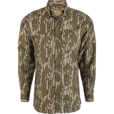 Youth Long-Sleeved Flyweight Shirt with earth-tone camo pattern on mannequin, featuring Drake label, two chest pockets, button-up design, and vented cape back.