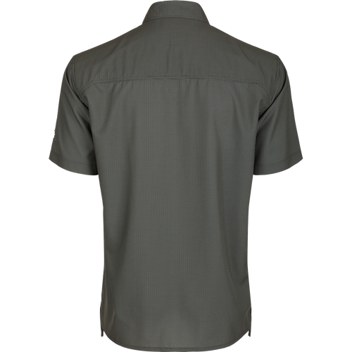 A back view of the Traveler's Check Shirt S/S, a lightweight, breathable shirt with Four Way Stretch for freedom of movement. Ideal for the man on the go, whether on vacation or running errands. Split tail hem allows for tucked or untucked wear.