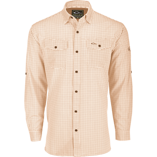 A lightweight, Four Way Stretch long sleeve shirt with a checkered pattern. Perfect for the man on the go, whether on vacation or running errands. Features include hidden button-down collar, adjustable roll-up sleeves, and two chest pockets. From Drake Waterfowl.