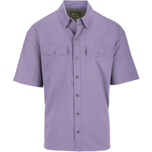 Traveler's Solid Dobby Shirt S/S, a purple button-up shirt with hidden button-down collar, chest pockets, and split tail hem.