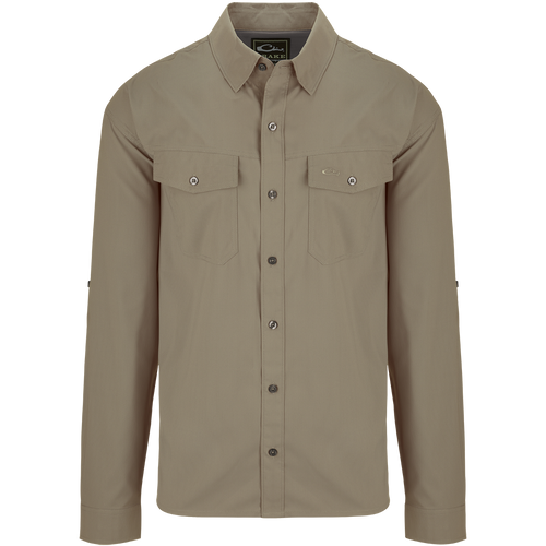 Traveler's Solid Dobby Shirt L/S: A classic fit, long-sleeved shirt with hidden button-down collar, chest pockets, and split tail hem. Made of featherweight, moisture-wicking fabric with UPF30 sun protection. Versatile for any occasion.