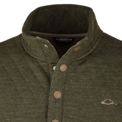 Lifestyle Delta Quilted Over Under Sweatshirt in olive green featuring a quilted texture, button-up placket, and mallard duck logo on the chest, crafted from heavyweight cotton polyester.