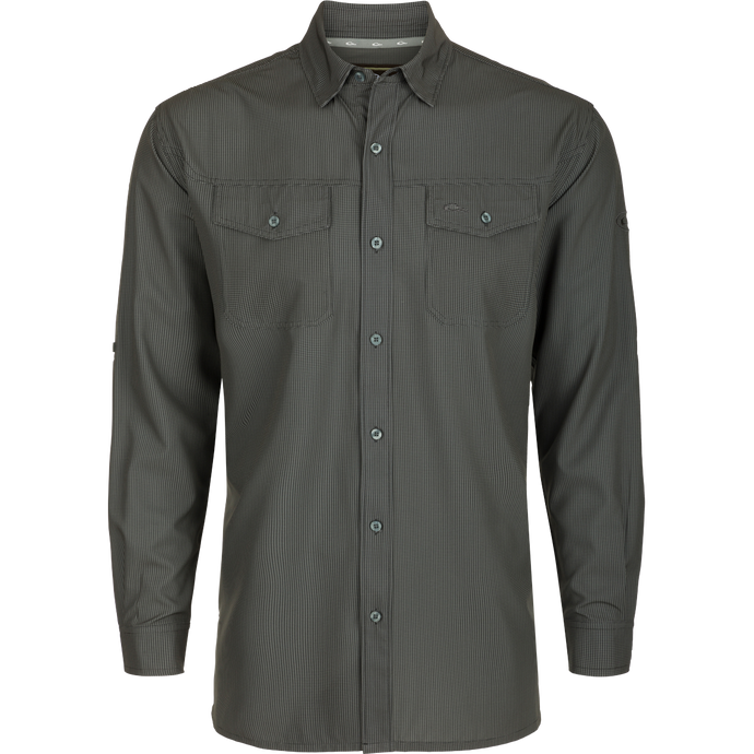 A lightweight, wrinkle-resistant Traveler's Check Shirt L/S for the man on the go. Moisture-wicking, with four-way stretch and two chest pockets with button flaps. Ideal for vacations or running errands.