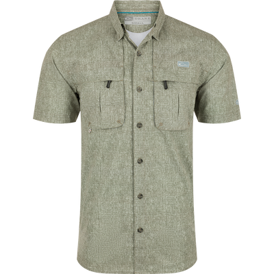 Heritage Heather Shirt S/S: A performance shirt with micro mesh fabric for natural cooling, UPF30 sun protection, and moisture-wicking properties. Features include a hidden button-down collar, vented cape back, and two chest pockets. Perfect for outdoor activities or the office.