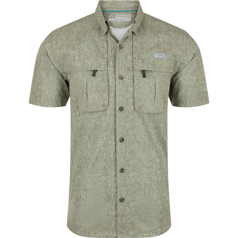 Heritage Heather Shirt S/S: A performance shirt with micro mesh fabric for natural cooling, UPF30 sun protection, and moisture-wicking properties. Features include a hidden button-down collar, vented cape back, and two chest pockets. Perfect for outdoor activities or the office.