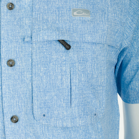 A close-up of the Drake Heritage Heather Shirt S/S, showcasing its button-down collar, chest pockets, and split tail hem.