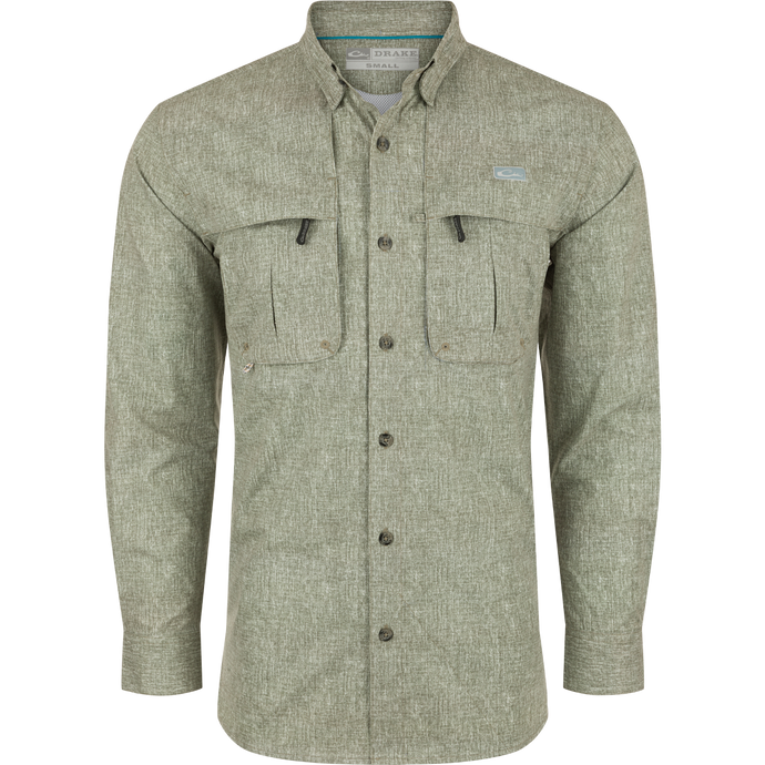 A Drake Heritage Heather Shirt L/S, a long-sleeved shirt with pockets. Made of 100% polyester micro mesh for natural cooling, moisture-wicking, and quick-drying. Features include a hidden button-down collar, vented cape back, and two front chest pockets. Perfect for performance on the water or at the office.