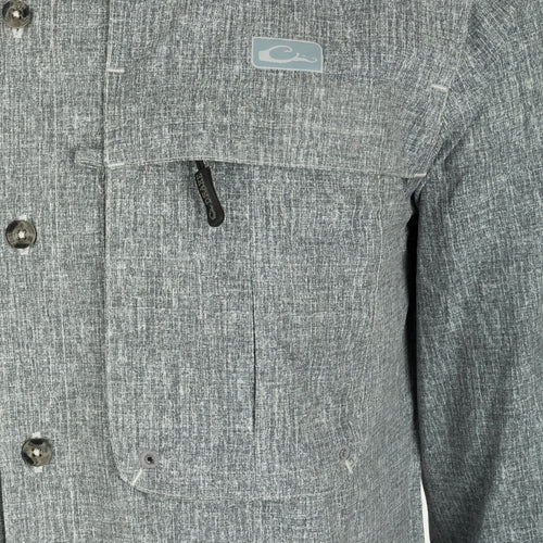 Heritage Heather Shirt L/S: A close-up of a jacket with a button, collar, and pocket.
