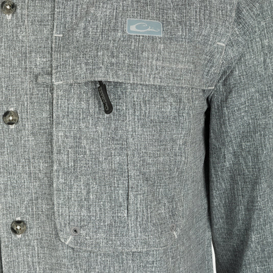 Heritage Heather Shirt L/S: A close-up of a jacket with a button, collar, and pocket.
