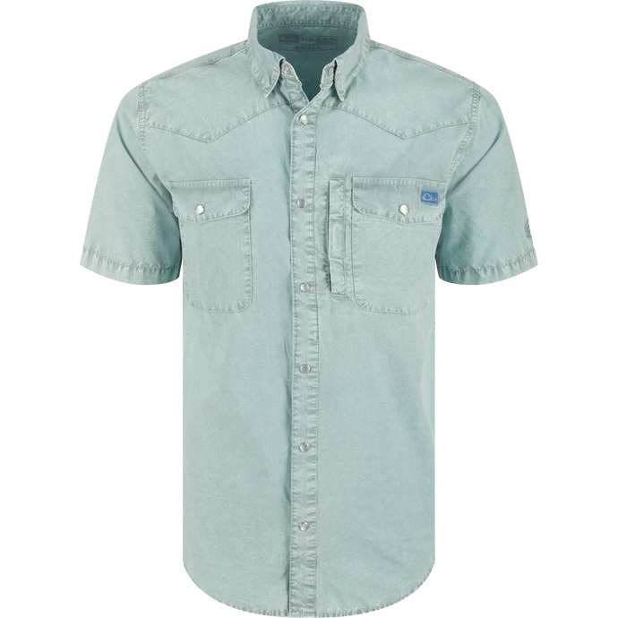 Cinco Ranch Western Acid Washed Short Sleeve Shirt with snap buttons, two flap pockets, utility pocket, and western yoke, ideal for versatile comfort and style.