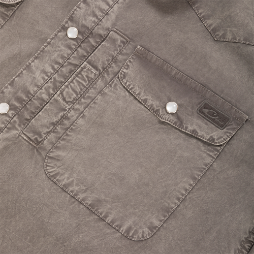 Close-up of Cinco Ranch Western Solid Acid Wash Long Sleeve Shirt showing flap pocket with pearl snap, brand label, and contrasting topstitching.