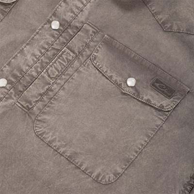 Close-up of the Cinco Ranch Western Solid Acid Wash Long Sleeve Shirt, featuring patch pockets, top-stitched flaps, and round metal snap-button closures with a subtle sheen.