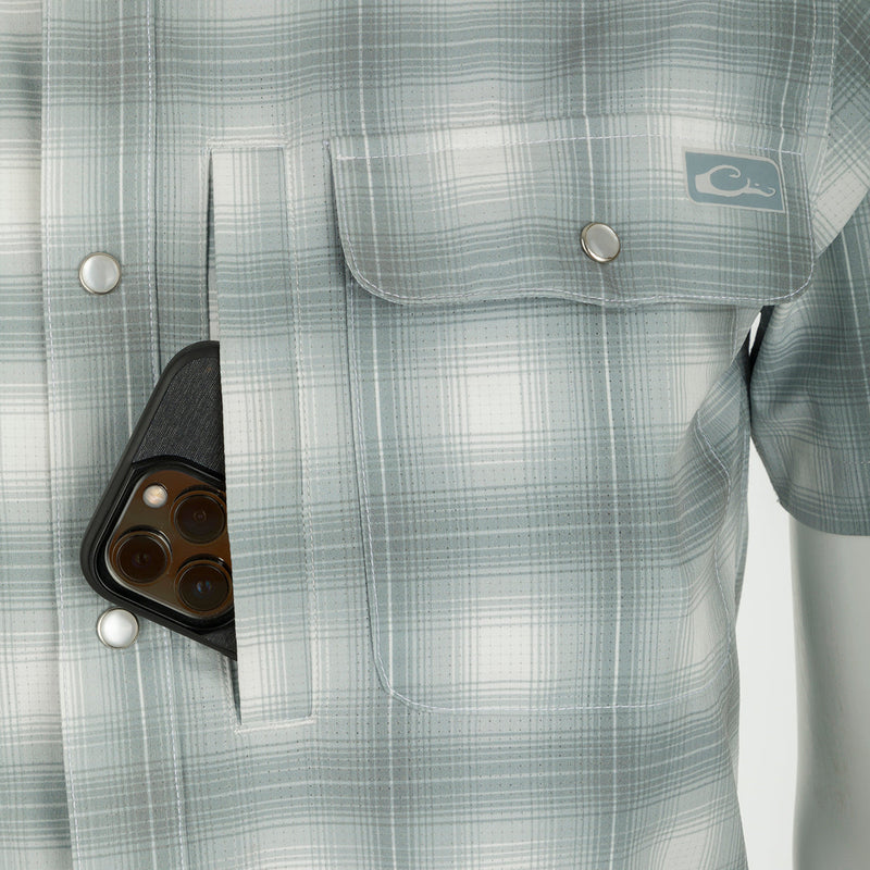 Cinco Ranch Western Plaid Shirt S/S: A cell phone in a pocket of this lightweight, moisture-wicking shirt with hidden button-down collar and vented back.