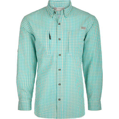 A classic seersucker grid check shirt with a hidden button-down collar, zippered chest pocket, and adjustable roll-up sleeves. Made from performance fabric for moisture-wicking and sun protection. Perfect for hunting and outdoor activities.