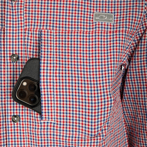 A close-up of the Classic Seersucker Grid Check Shirt L/S with a cell phone in the pocket.