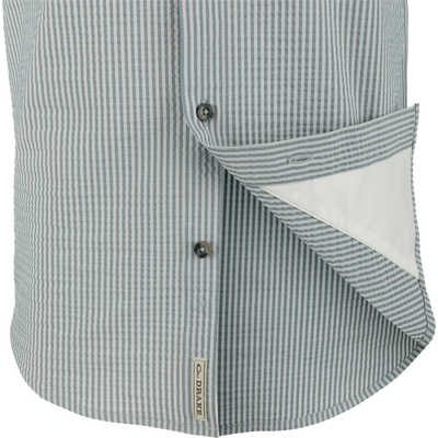 Frat Seersucker Striped Button-Down Short Sleeve Shirt close-up, highlighting its button and seersucker texture, featuring moisture-wicking performance fabric with hidden button-down collar design.