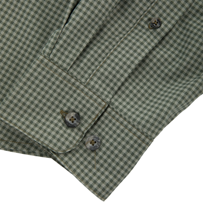 Close-up of the Frat Gingham Check Button-Down Long Sleeve Shirt cuff, showcasing green-and-off-white houndstooth fabric, two grey buttons, and precise placket stitching.