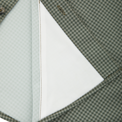 Close-up of a green-gray houndstooth jacket with folded lapel, showing a white pocket lining, highlighting the Frat Gingham Check Button-Down Long Sleeve Shirt's refined style.