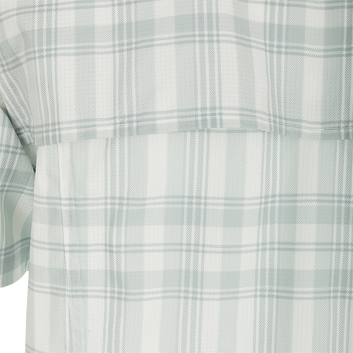 Frat Faded Plaid Short Sleeve Shirt, close-up of lightweight fabric with hidden button down collar, vented cape back, and two chest pockets.