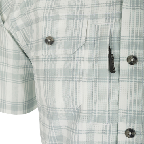 Frat Faded Plaid Short Sleeve Shirt with hidden button down collar, vented cape back, and two chest pockets. Lightweight and stretchy for comfort.