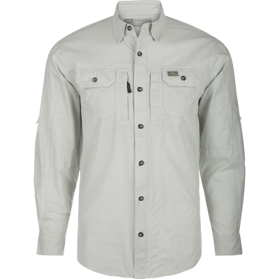 A technical houndstooth check shirt by Drake Waterfowl. Features include UPF30 sun protection, moisture-wicking fabric, hidden collar, chest pockets, and a sculpted hem for versatile wear.