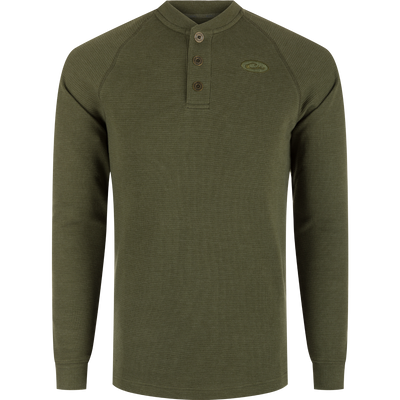 A durable Weston Lakes Waffle Henley in green, featuring raglan sleeves, metal logo buttons, ribbed collar, cuffs, and split tail hem. Ideal for hunting and outdoor activities.