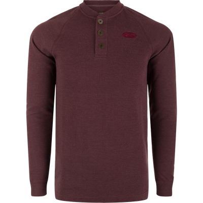 A Weston Lakes Waffle Long Sleeve Henley by Drake: Mélange fabric, raglan sleeves, metal logo buttons, rib knit collar and cuffs, split tail hem. Ideal for hunting and outdoor activities.