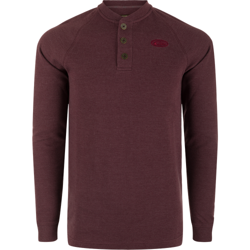 A Weston Lakes Waffle Long Sleeve Henley by Drake: Mélange fabric, raglan sleeves, metal logo buttons, rib knit collar and cuffs, split tail hem. Ideal for hunting and outdoor activities.