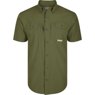 Wingshooter Trey Shirt S/S: Green shirt with buttons, hidden collar, flap pockets, vented back, and technical features for outdoor activities: Kalamata Olive