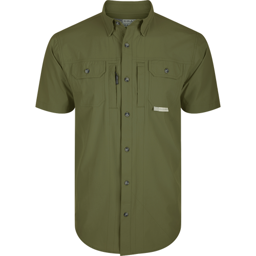Wingshooter Trey Shirt S/S: Green shirt with buttons, hidden collar, flap pockets, vented back, and technical features for outdoor activities: Kalamata Olive