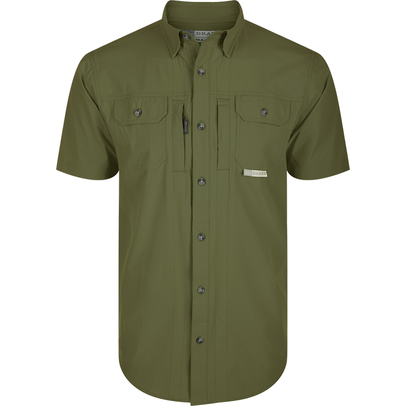Wingshooter Trey Shirt S/S: Green shirt with buttons, hidden collar, flap pockets, vented back, and technical features for outdoor activities: Kalamata Olive
