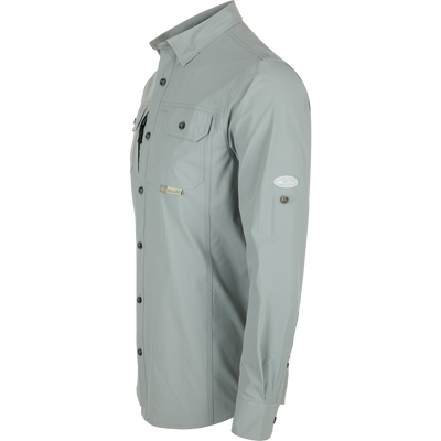 Wingshooter Trey Shirt L/S: Long-sleeved, performance fabric with hidden button-down collar, two chest pockets, vented cape back, adjustable sleeves, and sunglass wipe.
