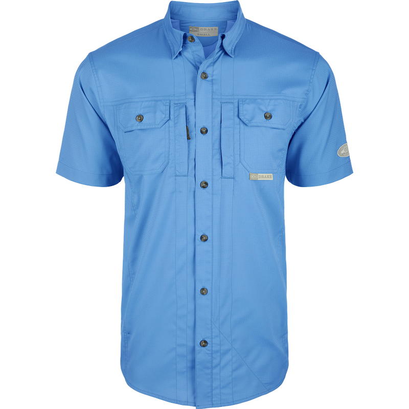 Marina Blue Wingshooter Trey Solid Dobby Shirt S/S, a performance shirt with hidden collar, vented back, and unique pocket system for outdoor activities.