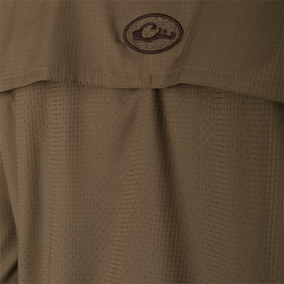 Wingshooter's Trey Dobby Button-Down Long Sleeve Shirt close-up, showcasing textured fabric, button-through flap chest pockets, and vented cape back for performance and versatility.