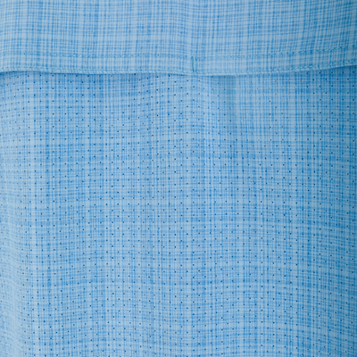 Close-up of the Wingshooter Trey Cross Hatch Shirt's light-blue woven fabric, highlighting the distinct cross-hatch weave and horizontal seam, showcasing its texture and craftsmanship.