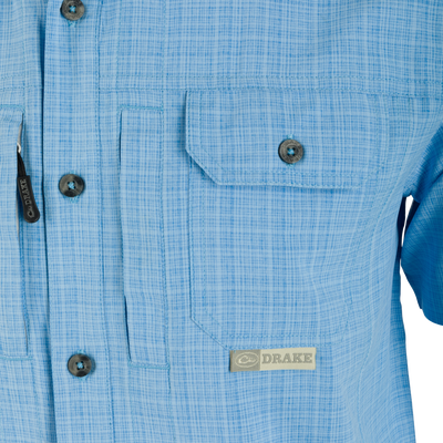 Wingshooter Trey Cross Hatch Short Sleeve Shirt with vented back, hidden button-down collar, and two chest pockets, showcasing premium performance features for outdoor activities.